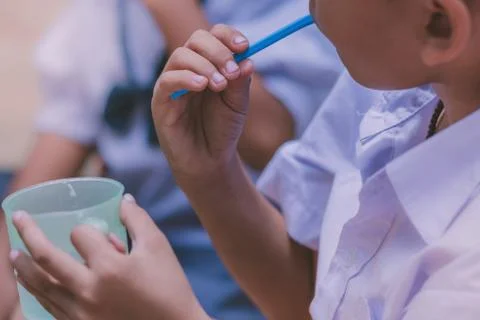 Elementary Students brush their teeth after lunch at school. Stock Photos