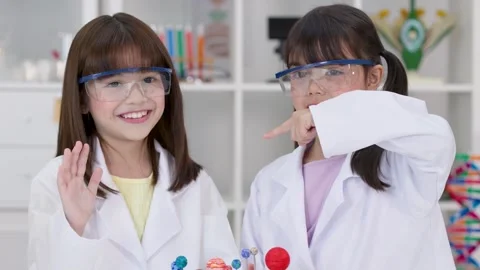 Elementary Students in Lab Coats Presenting Solar System Science Project Stock Footage 340244400