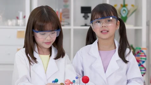 Elementary Students in Lab Coats Presenting Solar System Science Project Stock Footage 345318122