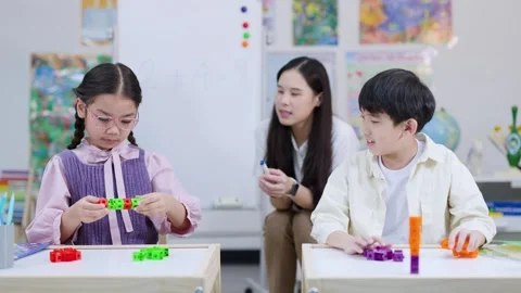 Elementary Students Solving Math Problem With Counting Blocks Stock Footage 325838837