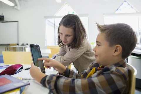 Elementary students using digital tablet in classroom 스톡 사진