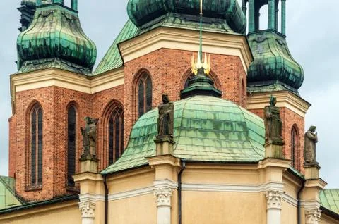 Elements of ancient architecture, statues on wall of the church Stock Photos