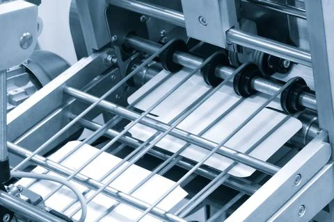 Elements of corton boxes are collected in stack. Conveyor line for the produc Foto stock