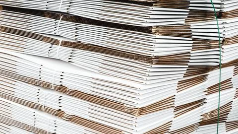 Elements of corton boxes collected in stack. Conveyor line for production of  Stock Photos