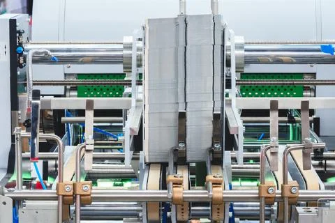 Elements of corton boxes collected in stack. Conveyor line for production of  Stock Photos
