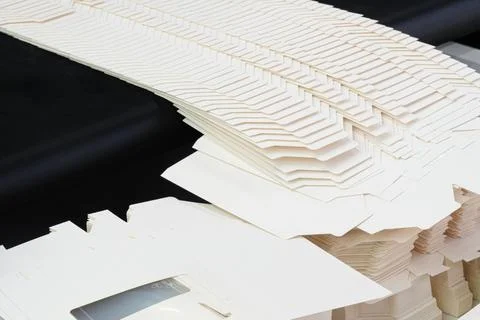 Elements of corton boxes collected in stack. Conveyor line for production of  Stock Photos