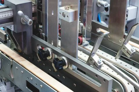 Elements of corton boxes collected in stack. Conveyor line for production of  Stock Photos