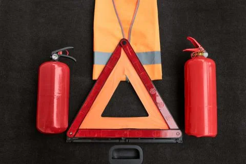 Elements of the essentials for a passenger car: manual fire extinguisher, fol Stock Photos