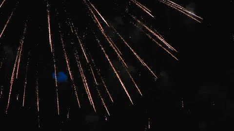Elements of an explosion of fireworks in the night sky. Stock Photos