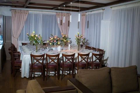 Elements home decorations. Festive table decorations, flowers and tableware Stock Photos