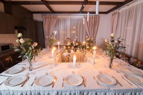 Elements home decorations. Festive table decorations, flowers and tableware Stock Photos