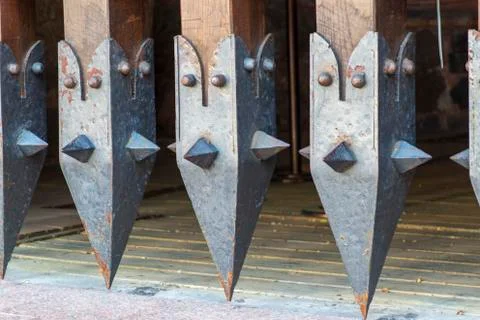 Elements of the old gate, sharp metal spiers. Stock Photos