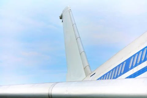 Elements of a passenger plane with a blue stripe closeup. Stock Photos