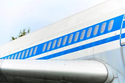Elements of a passenger plane with a blue stripe closeup. Fotos Stock
