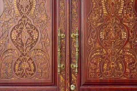 Elements of the pattern in oriental style on the door. Backgrounds and textur Stock Photos
