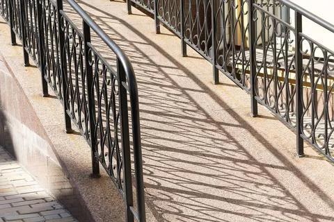 Elements of the railing of the house, staircase step with a steel board. Stock Photos