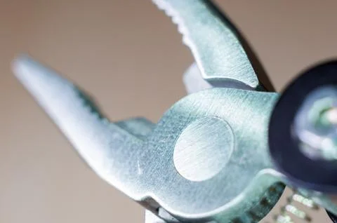 Elements small foldable steel multitool, close up, macro Foto stock