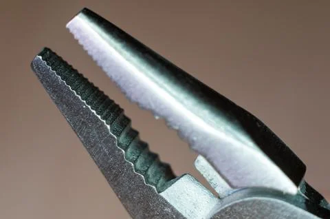 Elements small foldable steel multitool, close up, macro Stock Photos