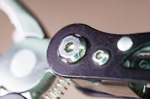 Elements small foldable steel multitool, close up, macro Stock Photos