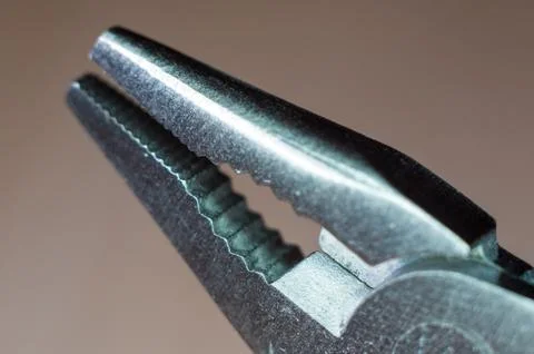 Elements small foldable steel multitool, close up, macro Stock Photos