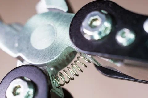 Elements small foldable steel multitool, close up, macro Stock Photos