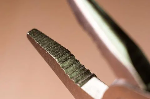 Elements small foldable steel multitool, close up, macro Foto stock