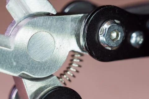 Elements small foldable steel multitool, close up, macro Foto stock