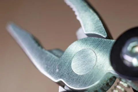 Elements small foldable steel multitool, close up, macro Foto stock