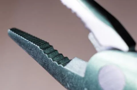 Elements small foldable steel multitool, close up, macro Foto stock