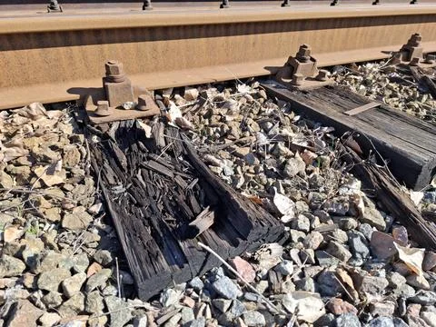 Elements of tram rail system, old rotten wooden sleepers Stock Photos