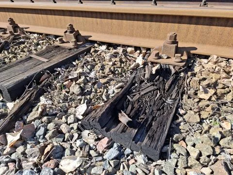 Elements of the tram rail system, old rotten wooden sleepers Stock Photos
