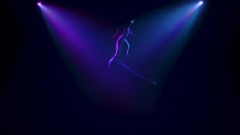 Elements of twine and balancing performed by a female aerial acrobat on an air Stock Footage 138861482