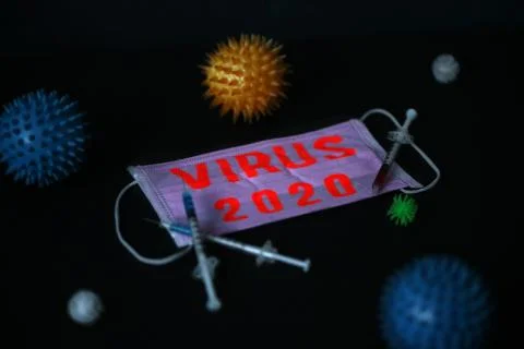 Elements of the virus. Medical mask on a red background with text. Coronavirus Stock Photos