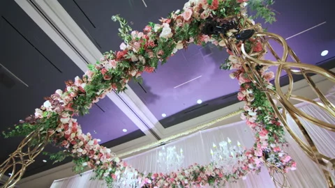 Elements of Wedding decor floral arch on reception party. move camera. wide shot 스톡 동영상 242349301