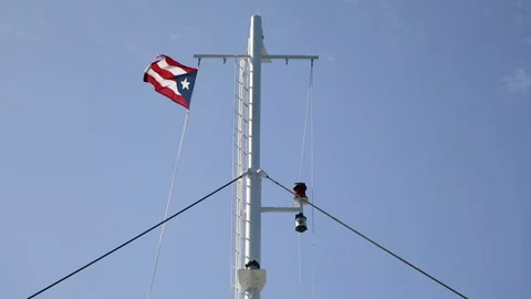 Elements of white ferry and flag on blue sky background Stock Footage 98312042