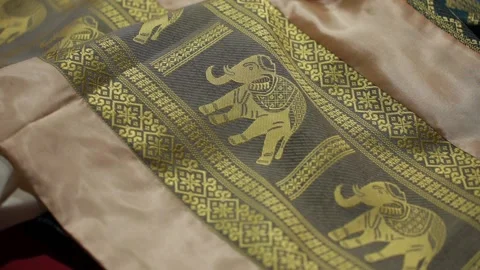 Elephant Embroidered Table Runner on Display at Night Market in Thailand Stock Footage 234852897
