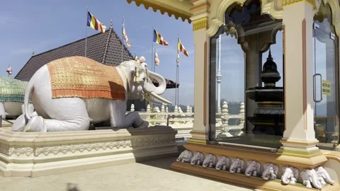 Elephant Statue at Buddhist Temple with Colorful Flags in Sri Lanka Video stock 331666983