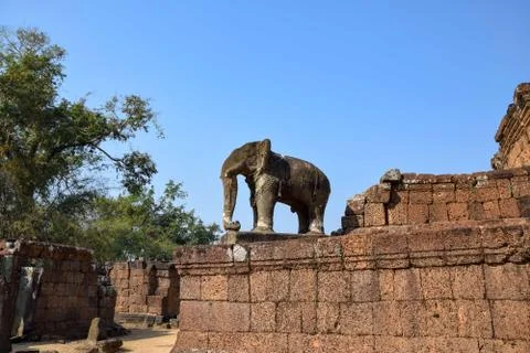 Elephant statue overlooking tress in ancient angkor wat temple ruins cambodia Stock Photos