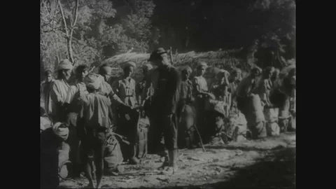 Elephants, native bearers and planes haul supplies for U.S. troops - 1943 Stock Footage 102181438
