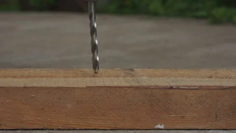 Eletro drill with a drill drills a board Video stock 131258638
