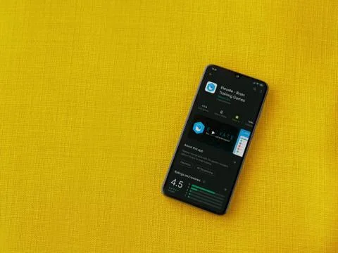 Elevate - Brain training games app play store page on the display of a black  Stock Photos
