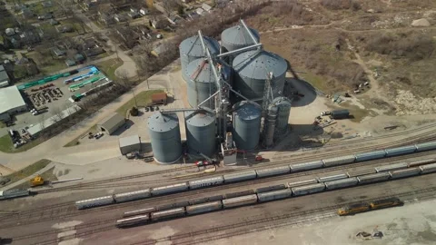 Elevated Aerial Orbit Of A Grain Facility And Passing Freight Train Stockbeeldmateriaal 342155556
