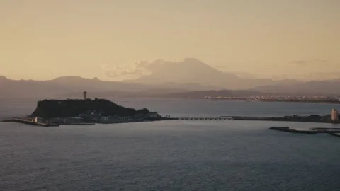 Elevated Aerial View of Enoshima Island and Mount Fuji at Sunset, Japan Stock Footage 345018596
