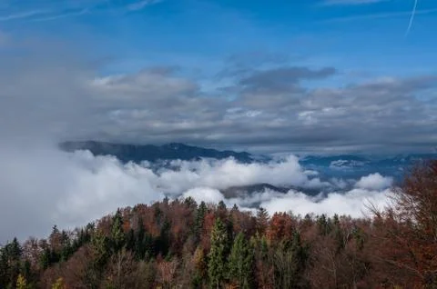 Elevated aerial view inversion clouds rolling in the valley Stock Photos