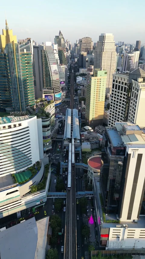 Elevated Bangkok Skytrain Moving Through Sukhumvit District, Bangkok, Thailand Stock Footage 335587626