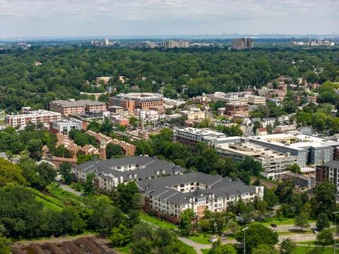 Elevated cityscape of White Plains surrounded by leafy suburban communities in N 写真素材