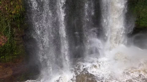Elevated Close View of a Massive Waterfall Cascading onto Rocks Stock Footage 347966882