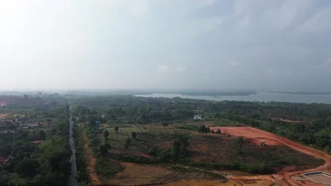 Elevated drone footage captures evolving terrain with lush greenery 動画素材 319458894