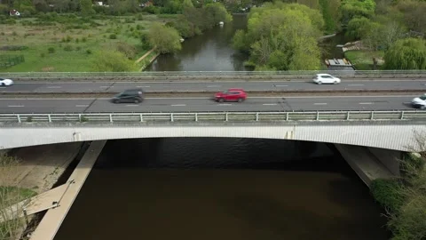 Elevated drone view of continuous traffic flow, featuring cars, vans, trucks, a Stock Footage 308418648