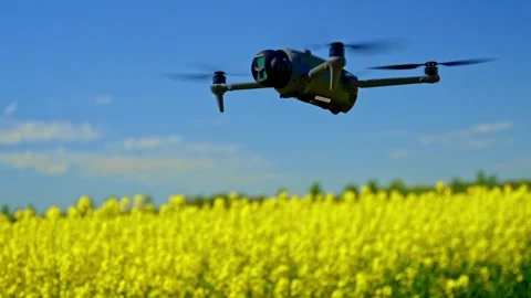 Elevated drone view of UAV for photography over open terrain Stock Footage 332936363
